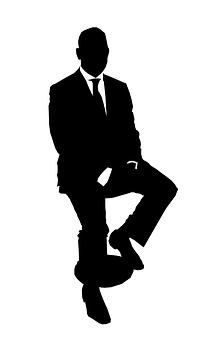 A Silhouette Of A Man In A Suit