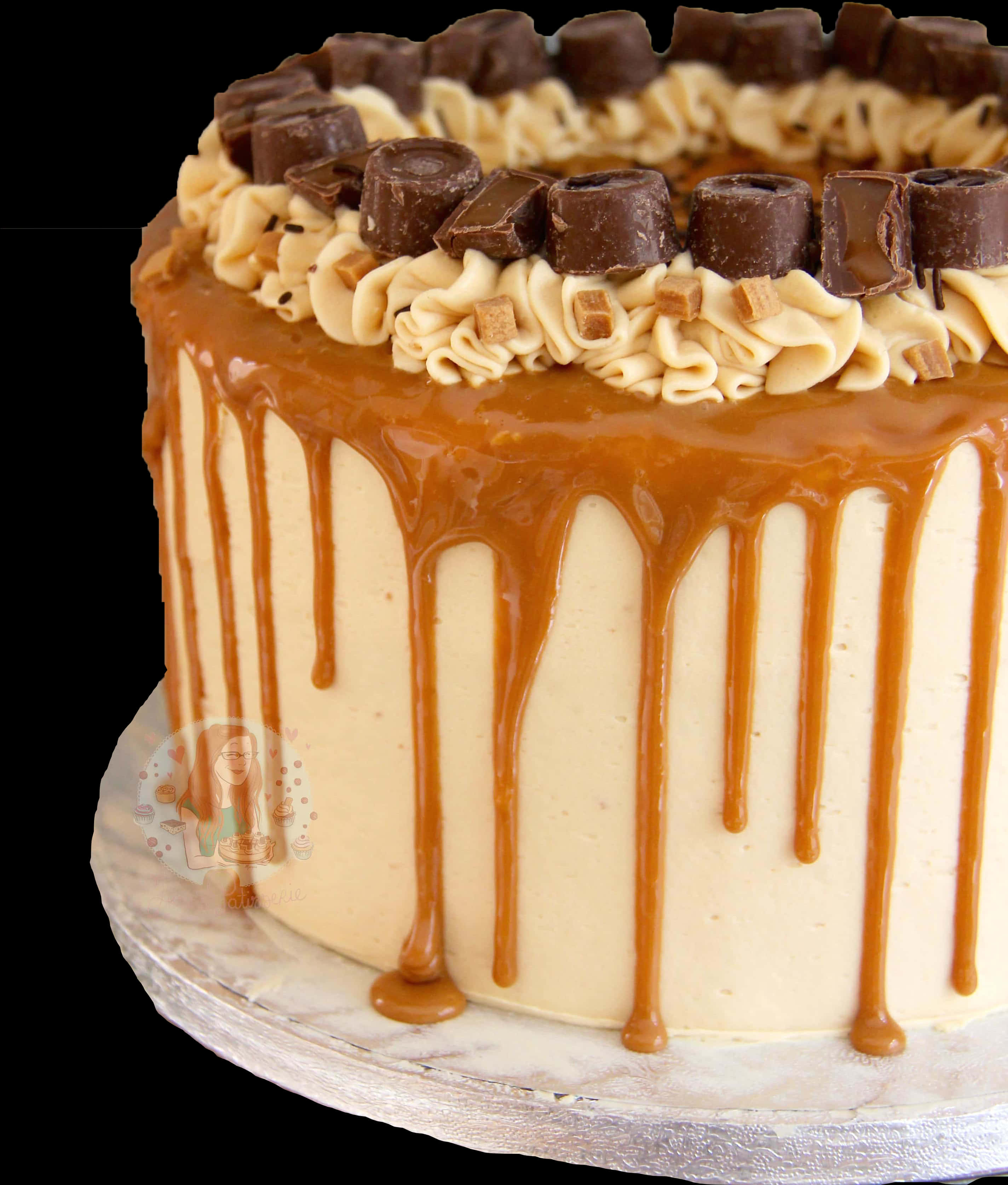A Cake With Caramel Icing And Chocolate Candies