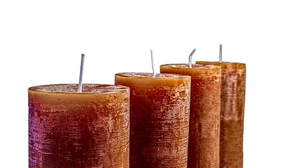 A Group Of Candles With Sticks