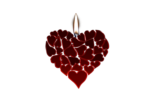 A Heart Shaped Candle With A Flame