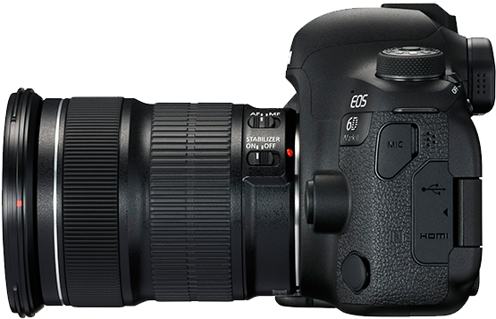 A Black Camera With A Long Lens