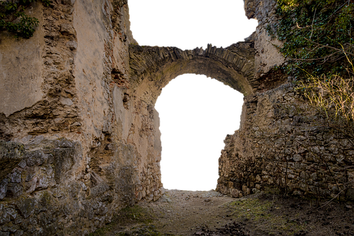 A Stone Archway With A Black Background