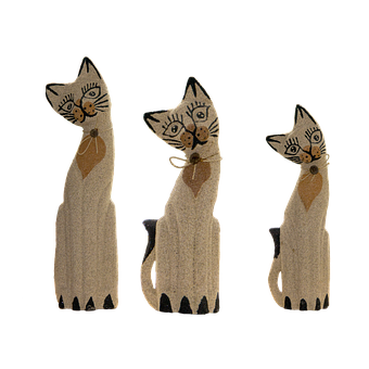 A Group Of Wooden Cats