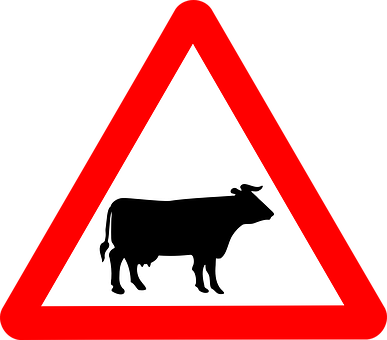 A Sign With A Cow In The Middle