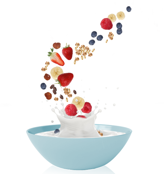 A Bowl Of Milk With Fruits Falling Into It