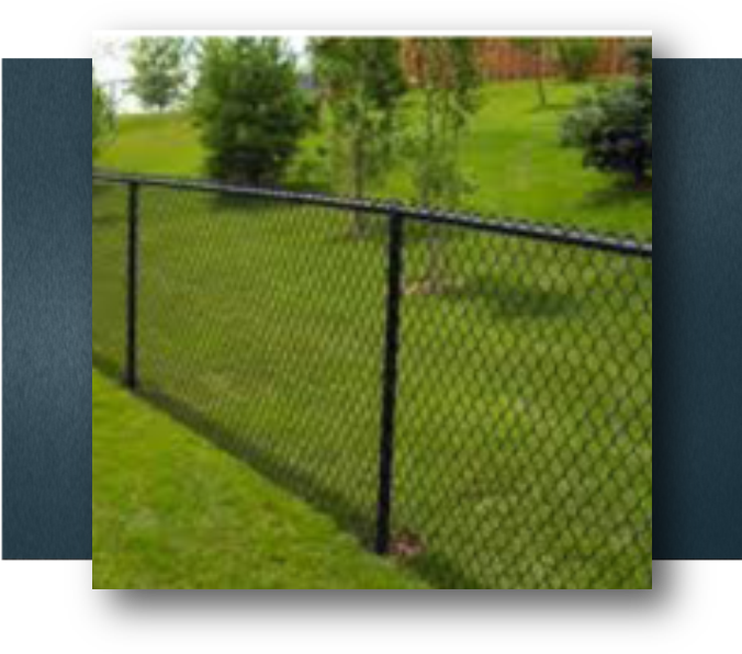 A Chain Link Fence In A Grassy Area