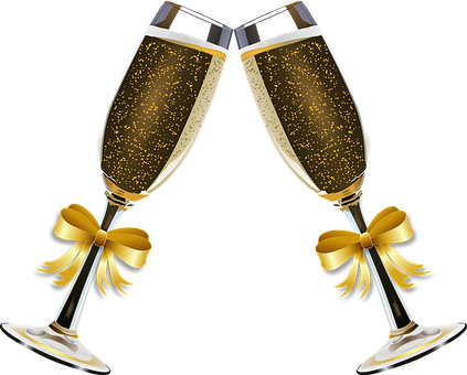 A Pair Of Champagne Glasses With Gold Bows