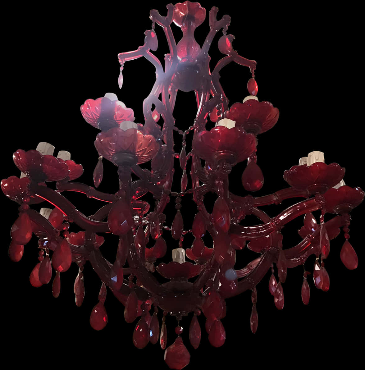 A Red Chandelier With White Candles