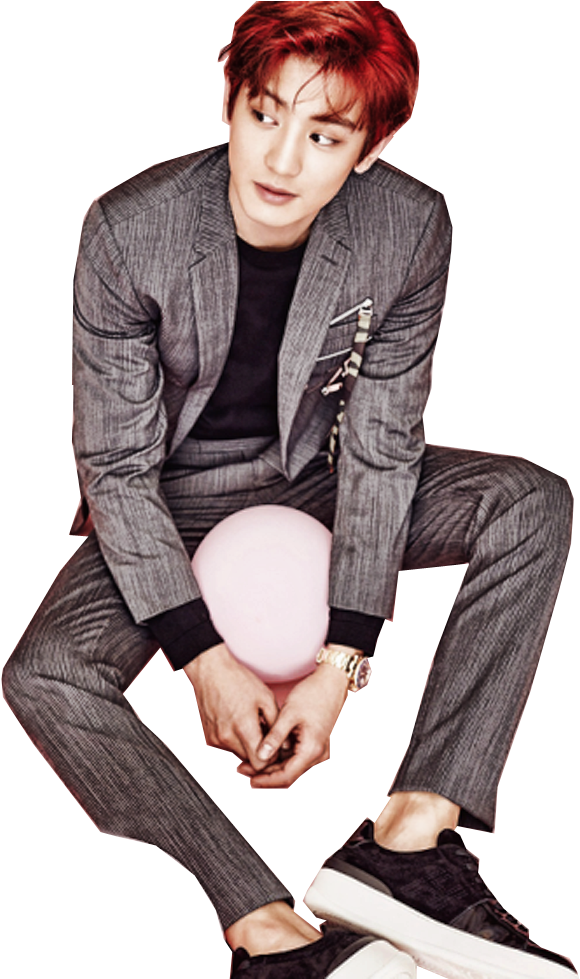 A Man In A Suit Sitting On A Balloon