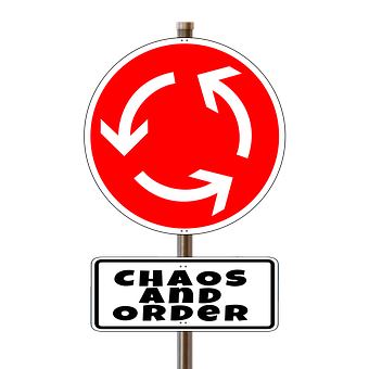A Red Sign With Arrows On It