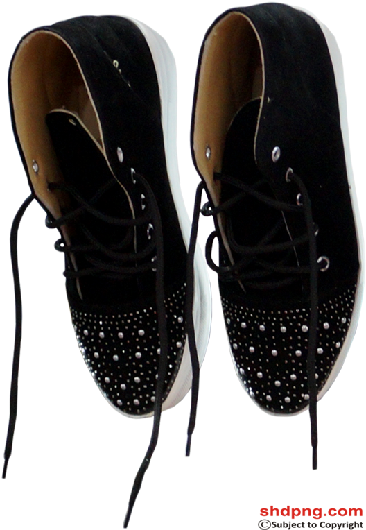 A Pair Of Black Shoes With White Soles