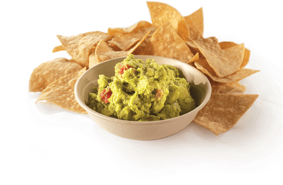 A Bowl Of Guacamole And Chips