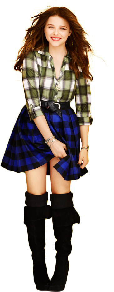 A Woman In A Plaid Shirt And Skirt