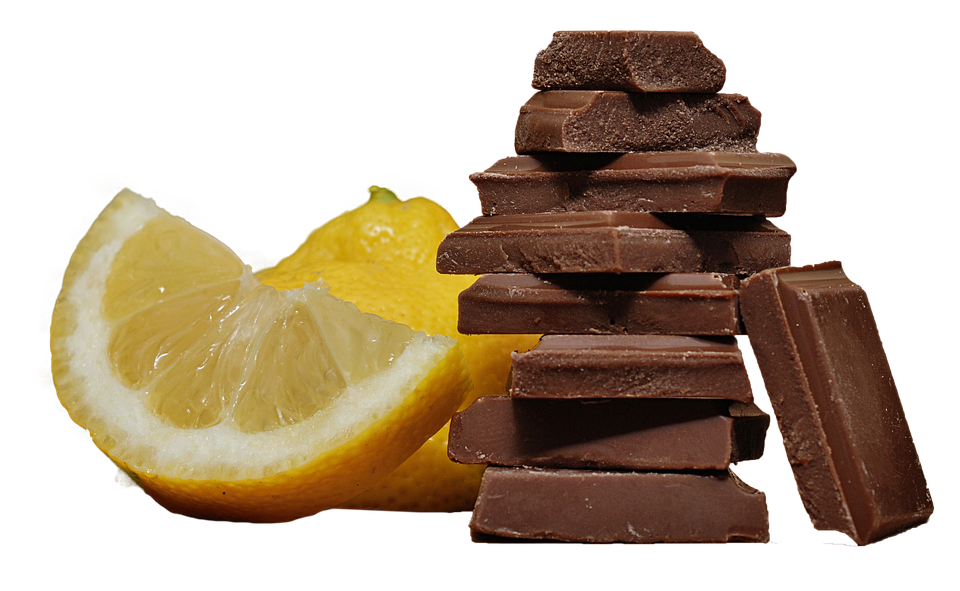 A Stack Of Chocolate And A Lemon