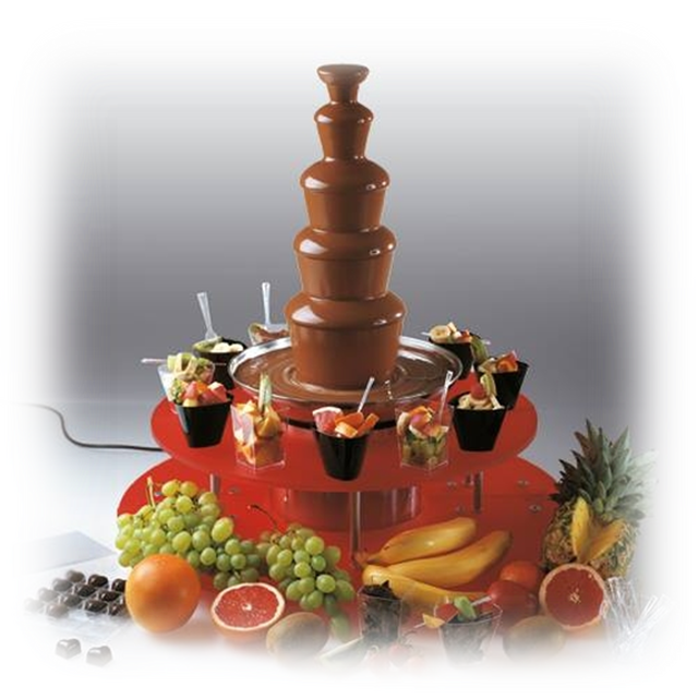 A Chocolate Fountain With Fruit On A Red Tray