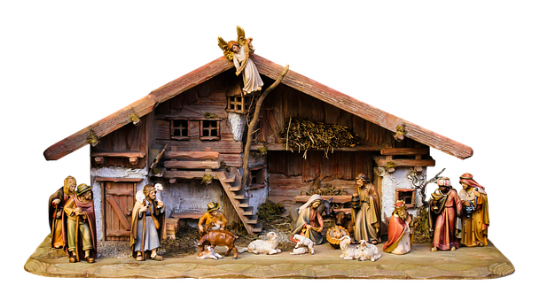 A Nativity Scene With Statues And A Barn