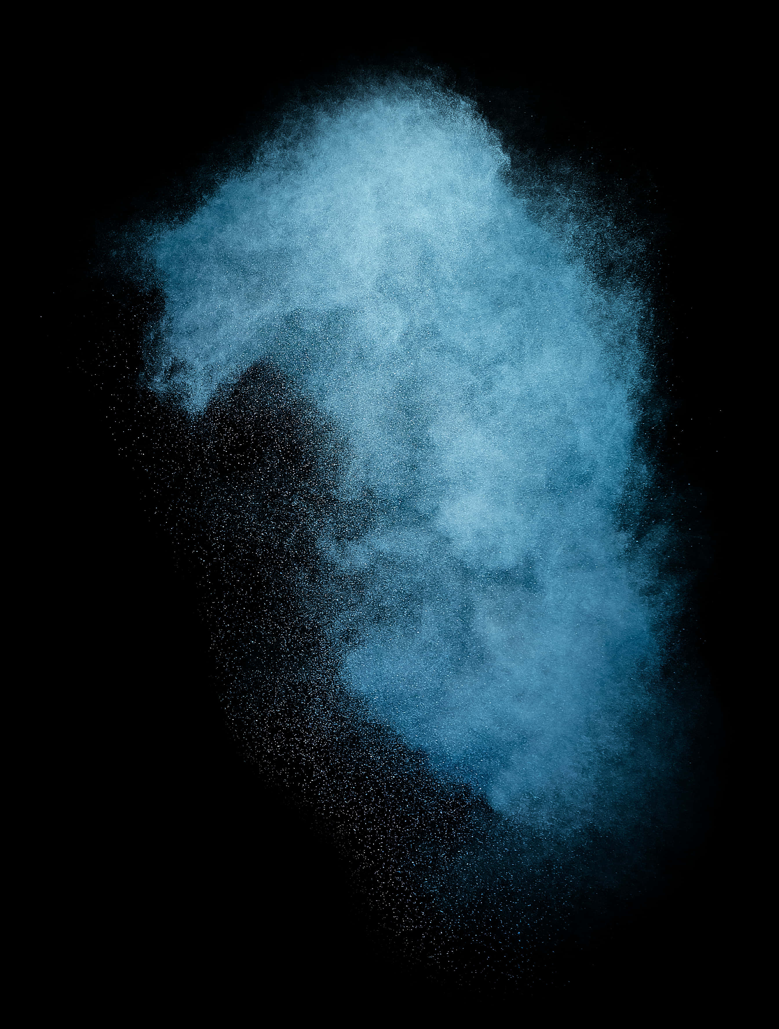 A Blue Powder Explosion On A Black Background