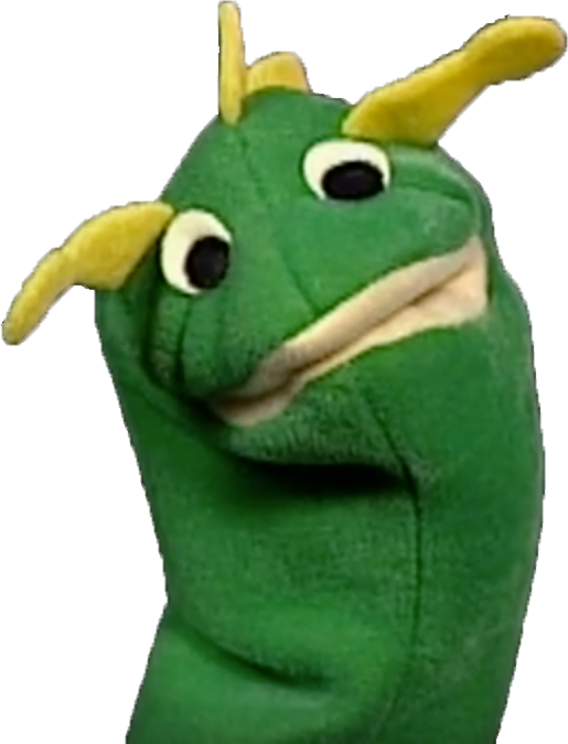 A Green Hand Puppet With Yellow Horns