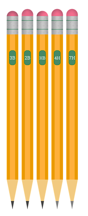 A Group Of Pencils With Green Tops