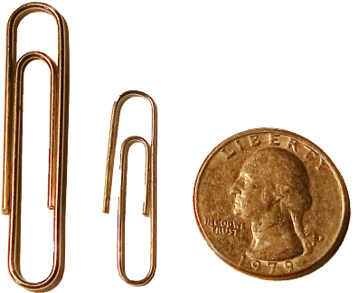 A Close Up Of A Coin And Paper Clips