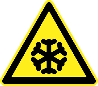 A Yellow Triangle Sign With A Black Snowflake
