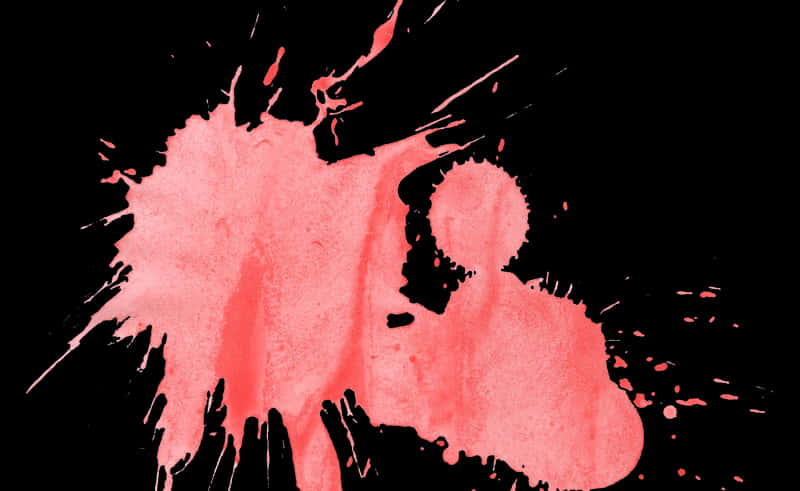 A Red Paint Splatter On A Black Background