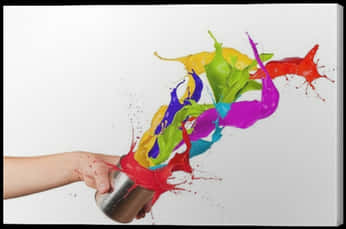 A Hand Holding A Can With Paint Splashing Out Of It