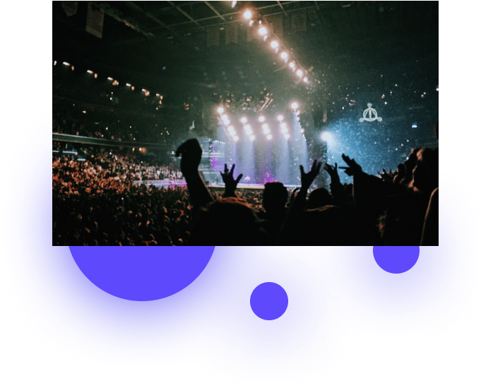 A Crowd Of People At A Concert