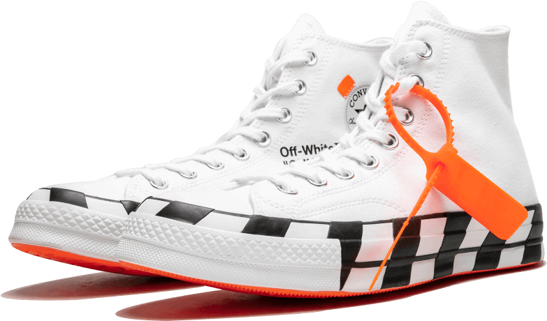 A Pair Of White Sneakers With Black And Orange Stripes