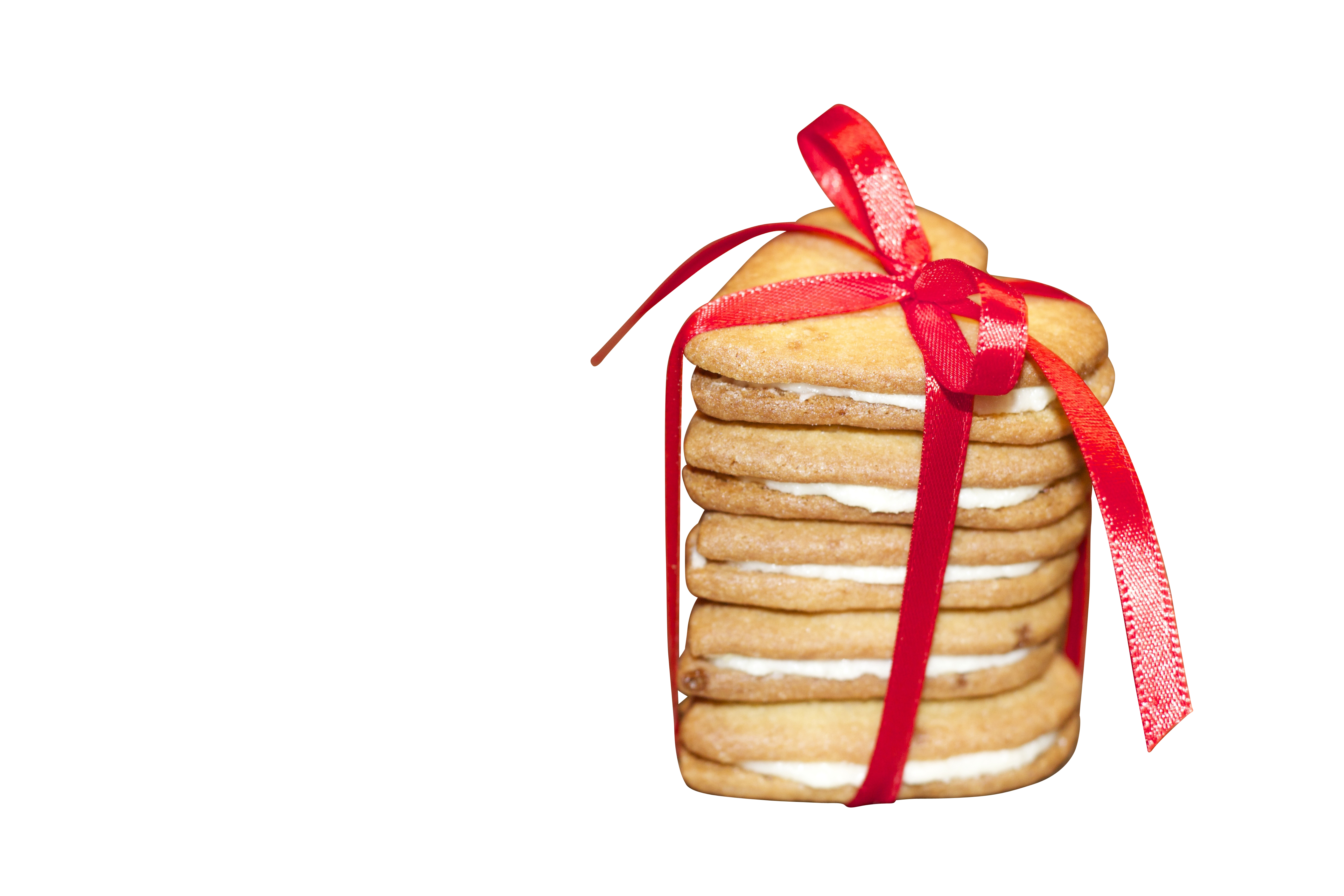 A Stack Of Cookies Tied With A Red Ribbon