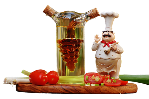 A Chef Figurine And A Bottle Of Oil