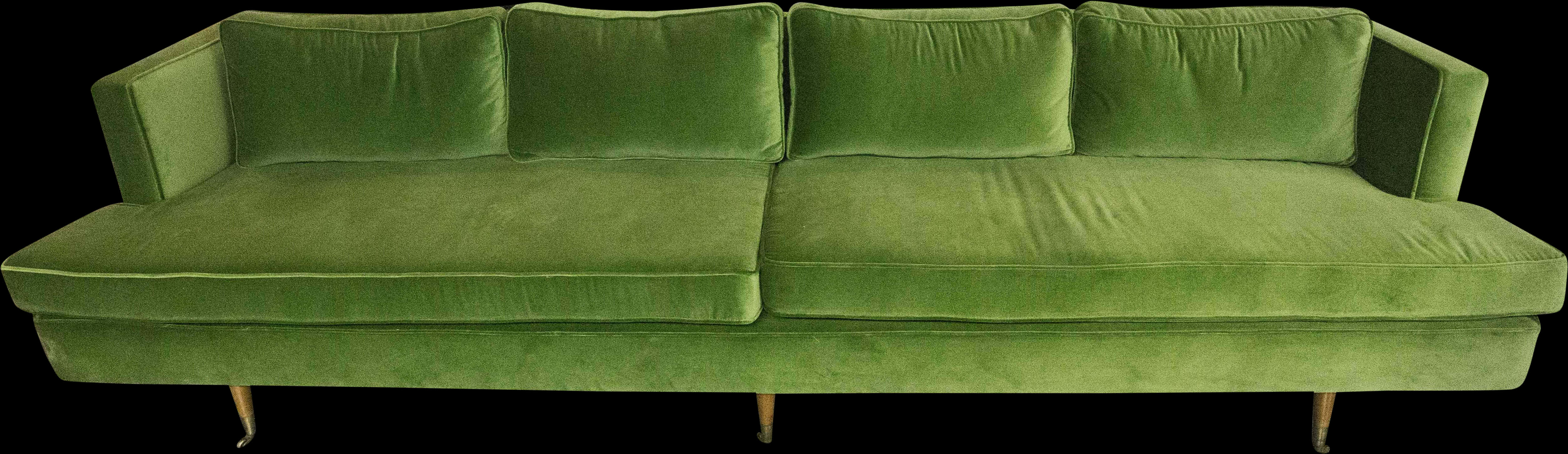 A Green Couch With Wooden Legs