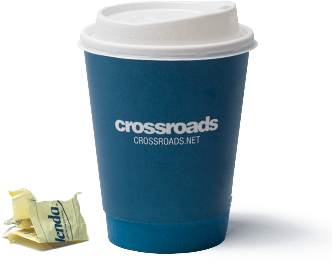 A Blue Coffee Cup With White Lid And A Yellow Packet