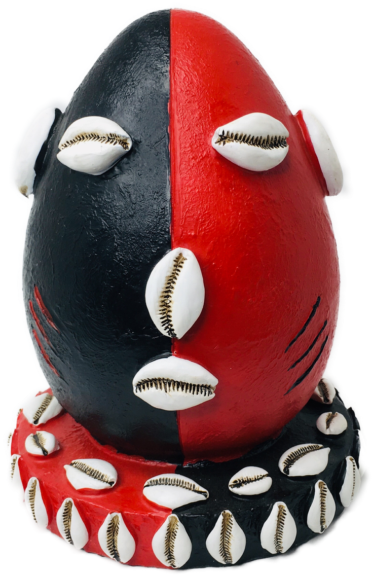 A Red And Black Egg With White Balls
