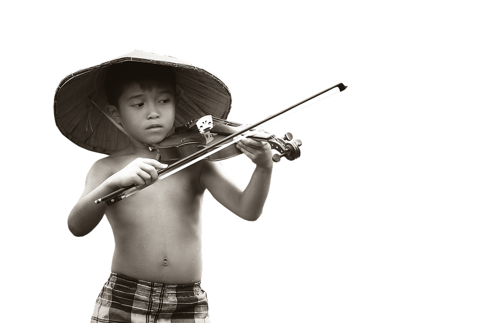 A Boy Playing A Violin