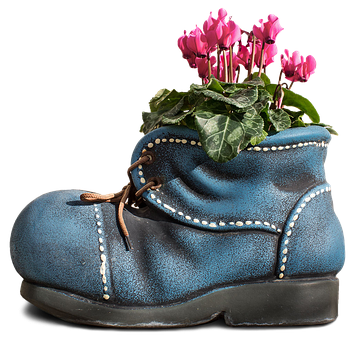 A Blue Boot With Pink Flowers In It