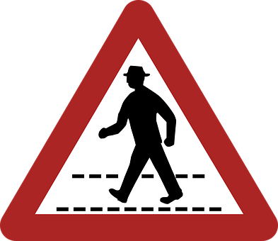 A Red And White Sign With A Silhouette Of A Man Walking