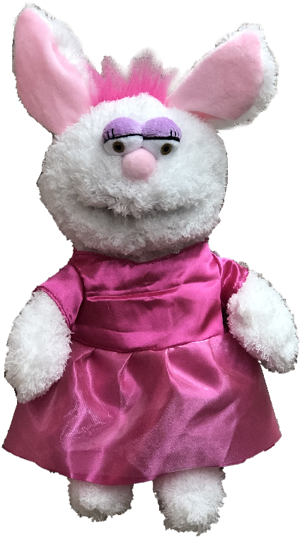 A Stuffed Animal In A Pink Dress