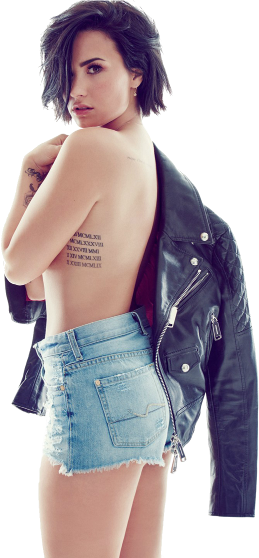 A Woman With A Leather Jacket And A Tattoo On Her Back