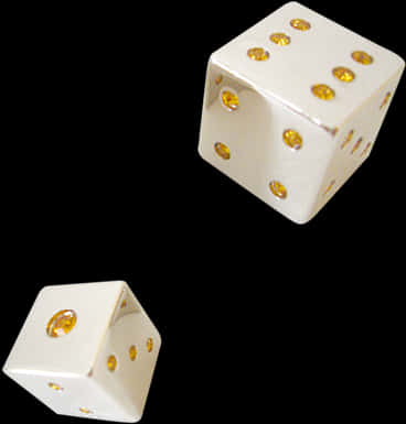 A Pair Of White Dice With Yellow Dots