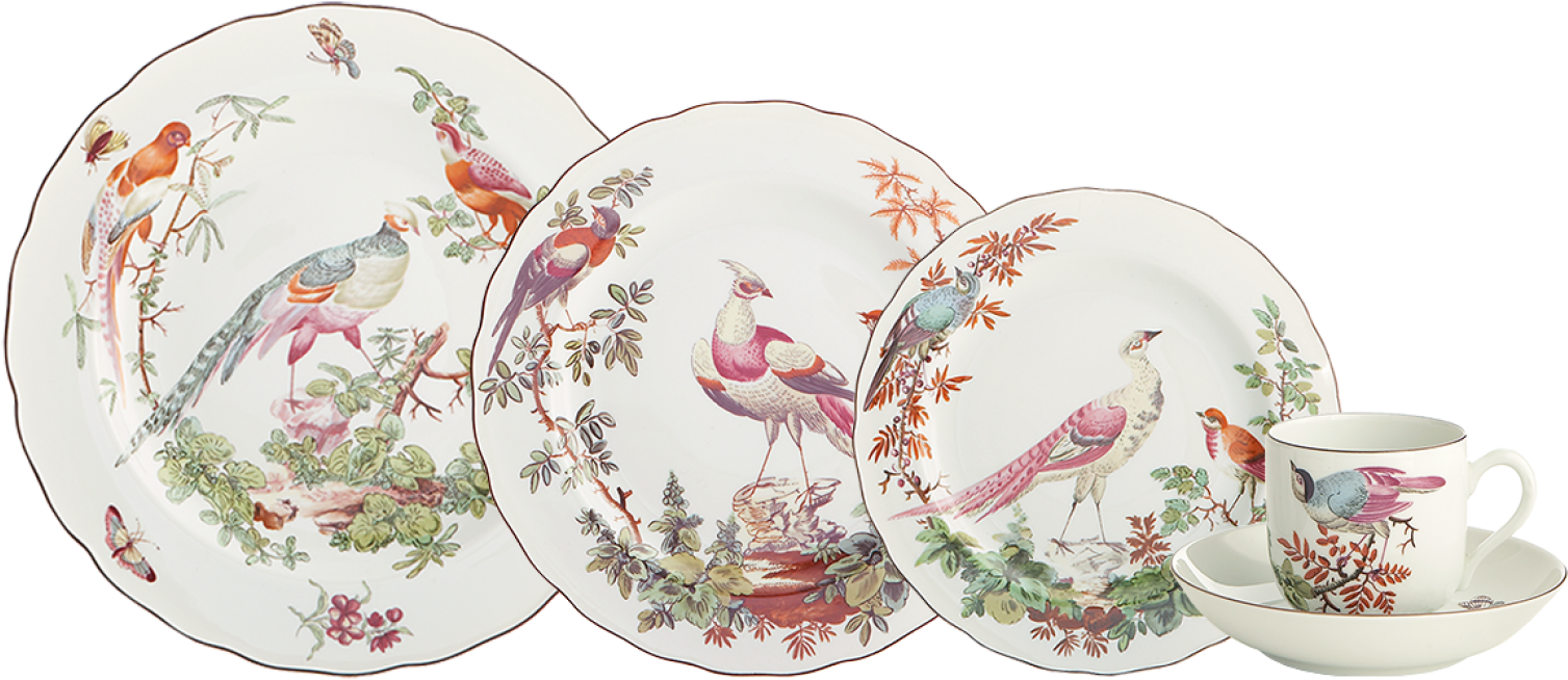 A Group Of Plates With Birds On Them