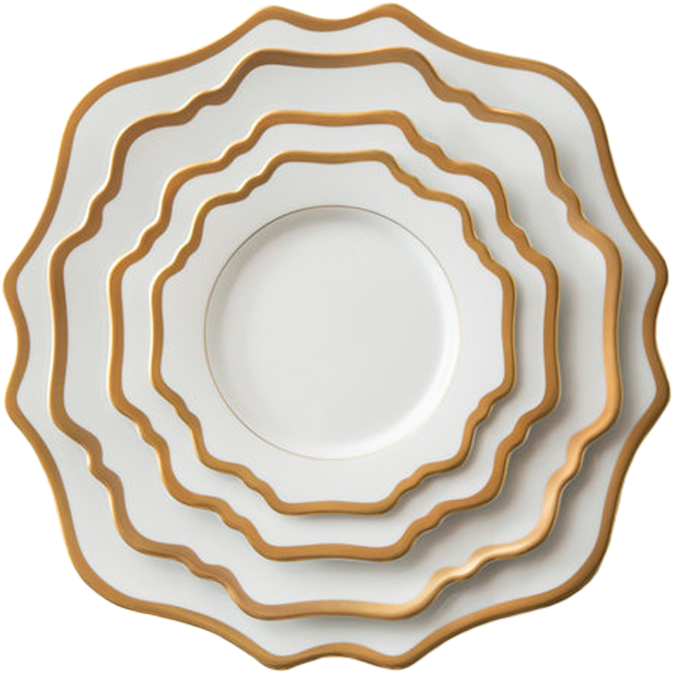 A Stack Of White And Gold Plates
