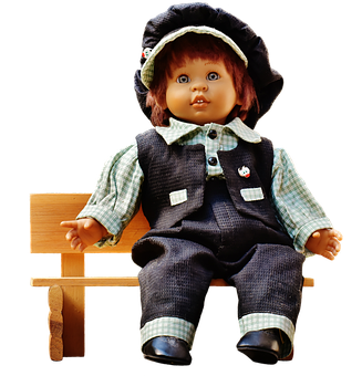 A Doll Sitting On A Bench