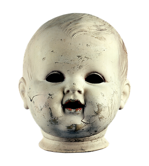 A Close Up Of A Doll Head