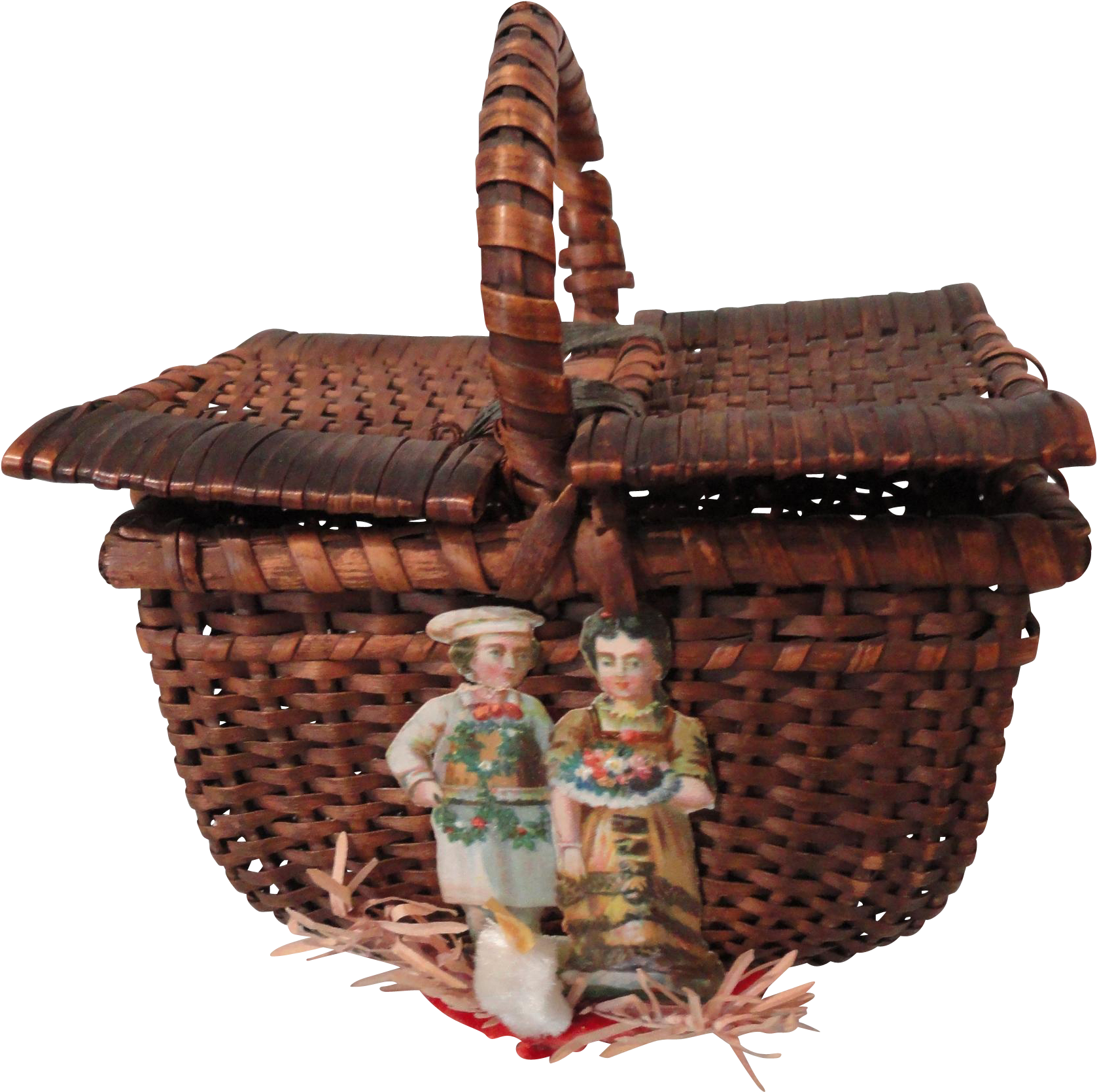 A Basket With A Couple Of Dolls