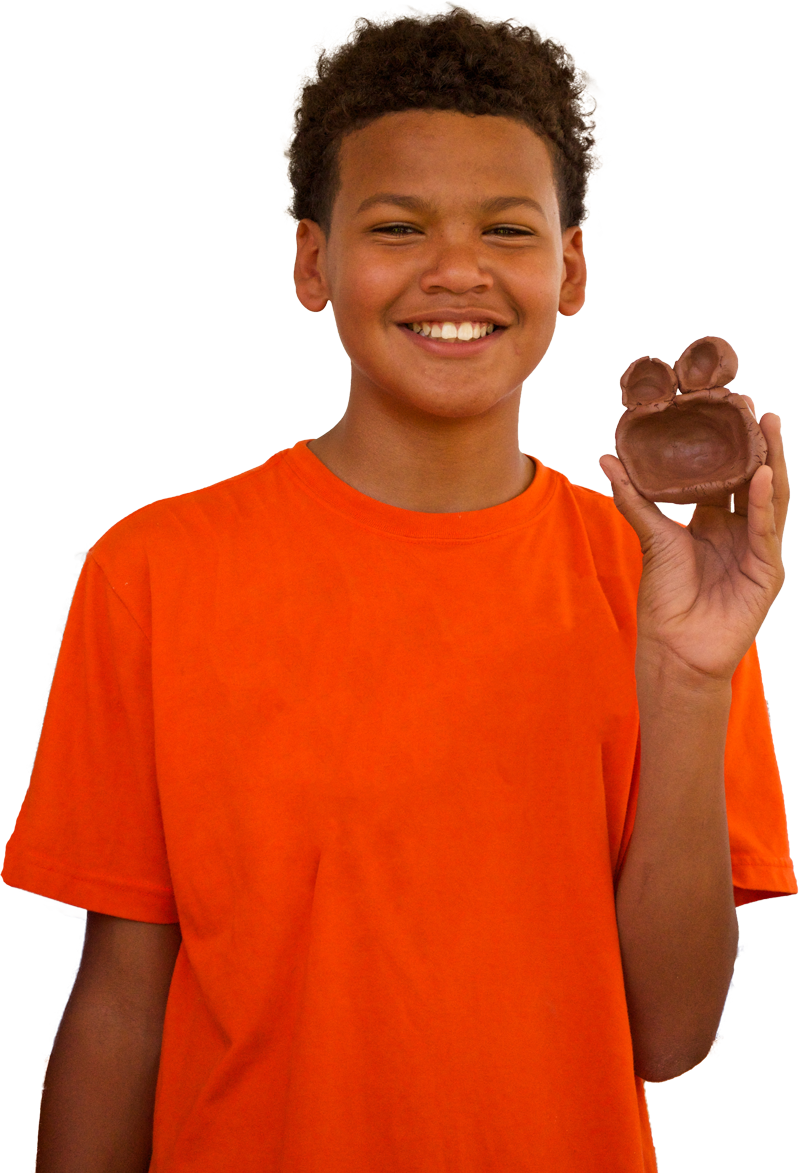 A Boy Holding A Small Object