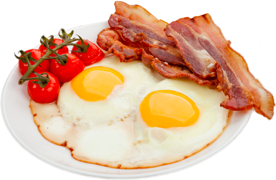 A Plate Of Eggs Bacon And Tomatoes