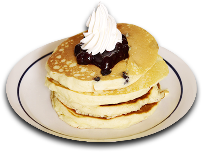 A Stack Of Pancakes With Whipped Cream On Top