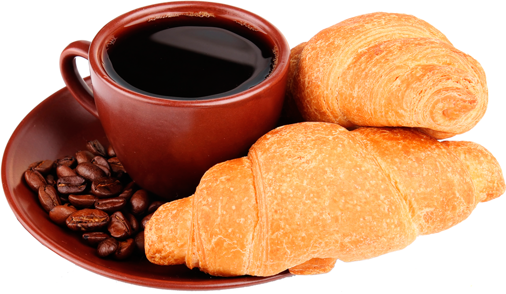A Plate Of Croissants And Coffee