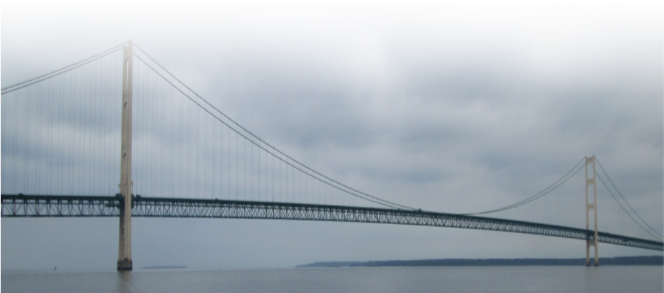 A Bridge Over Water With Clouds